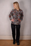 Tamie-crepe. 100% Silk crepe shirt. Print "Susminor"by artist Suse Hartung