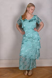 Ann-Frida, Maxi dress in several layers of silk. (Light Turqoise)